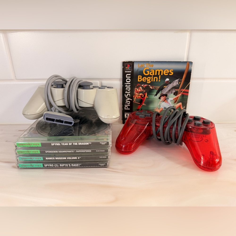 2 Sony PlayStation Controllers - with 5 games for PlayStation